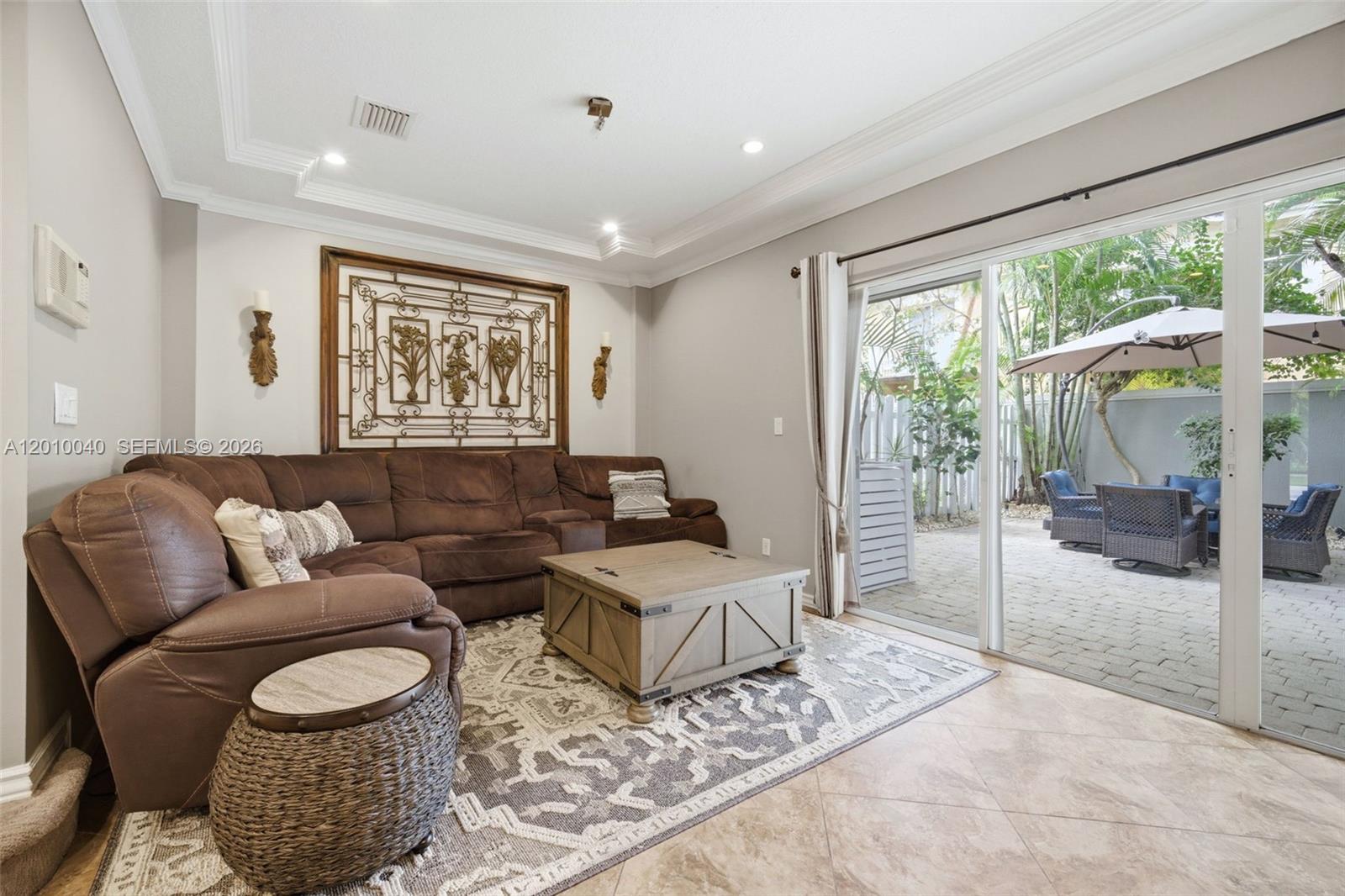 12978 Southwest 29th Court Miramar, FL 33027 - Photo 13 of 32 a living room with furniture and a floor to ceiling window