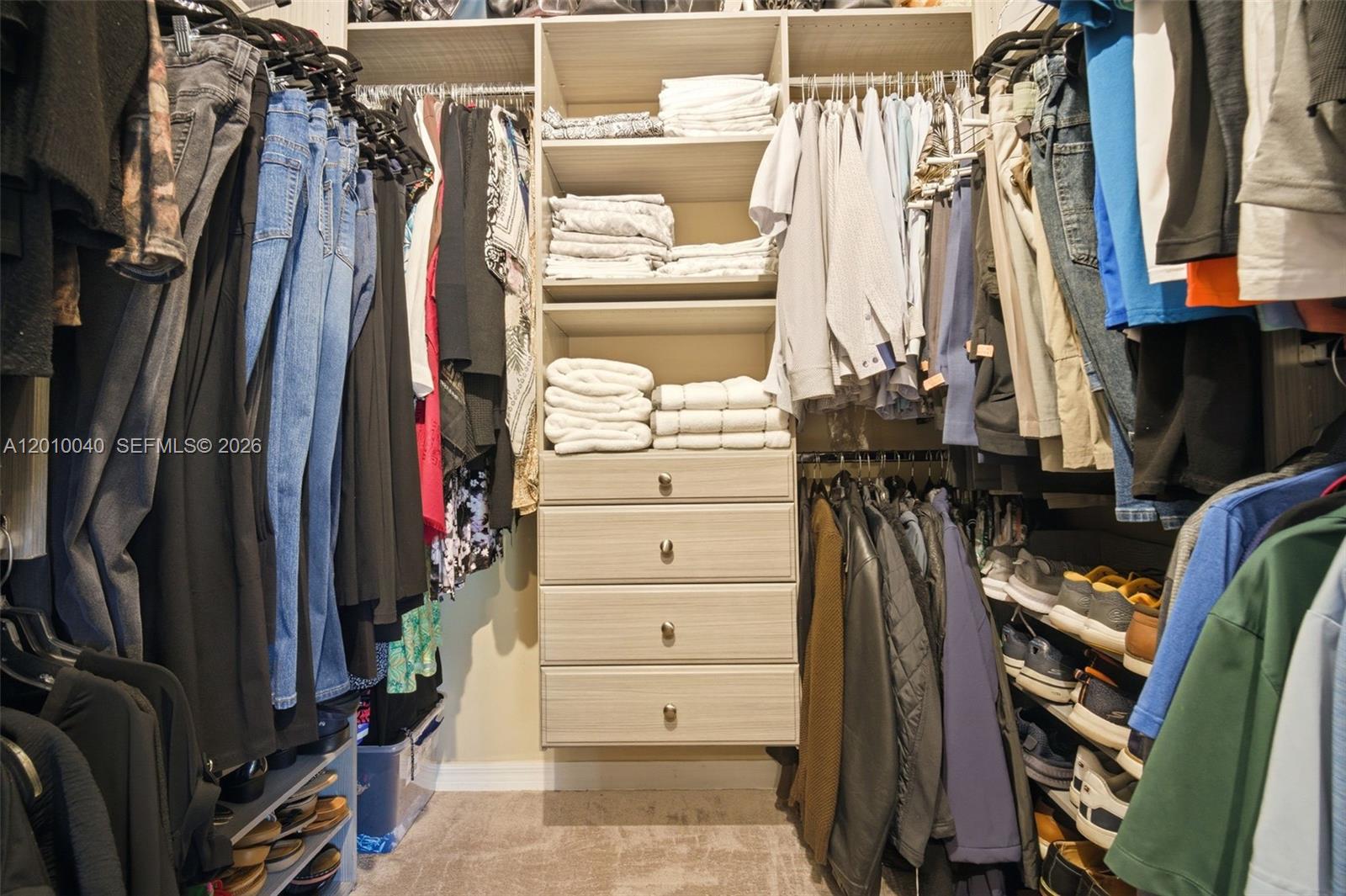 12978 Southwest 29th Court Miramar, FL 33027 - Photo 21 of 32 a view of walk in closet with clothes and shoes