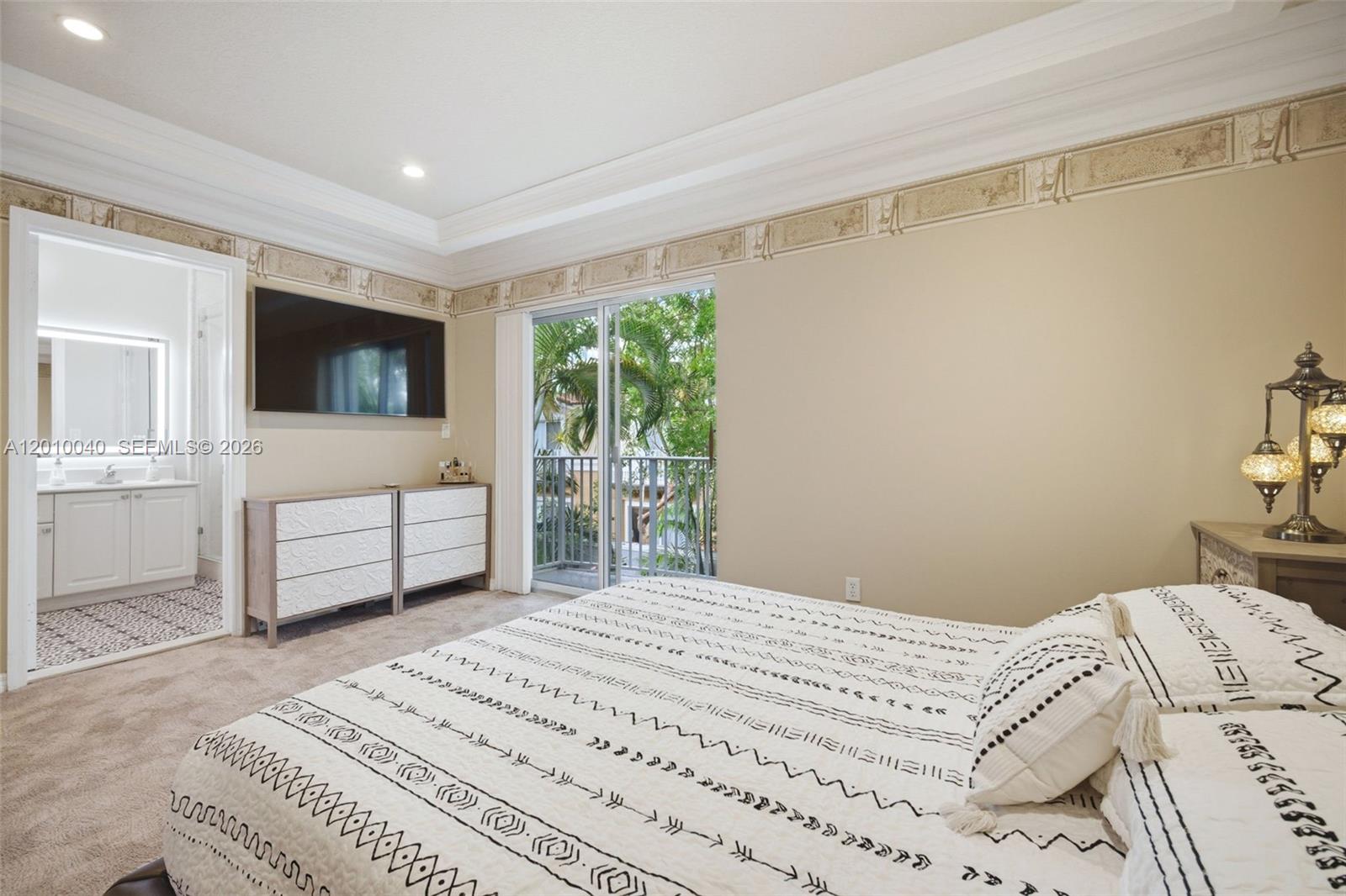12978 Southwest 29th Court Miramar, FL 33027 - Photo 22 of 32 a bedroom with a bed and a flat screen tv