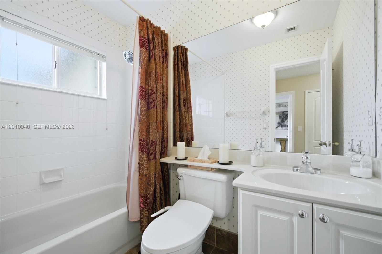12978 Southwest 29th Court Miramar, FL 33027 - Photo 26 of 32 a bathroom with a double vanity sink toilet and shower
