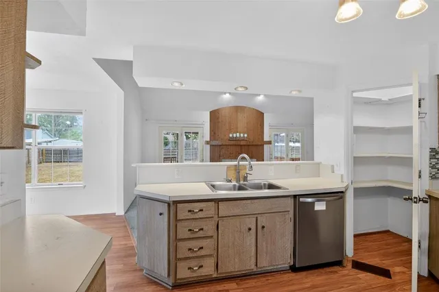 a bathroom with a granite countertop sink a mirror and a vanity