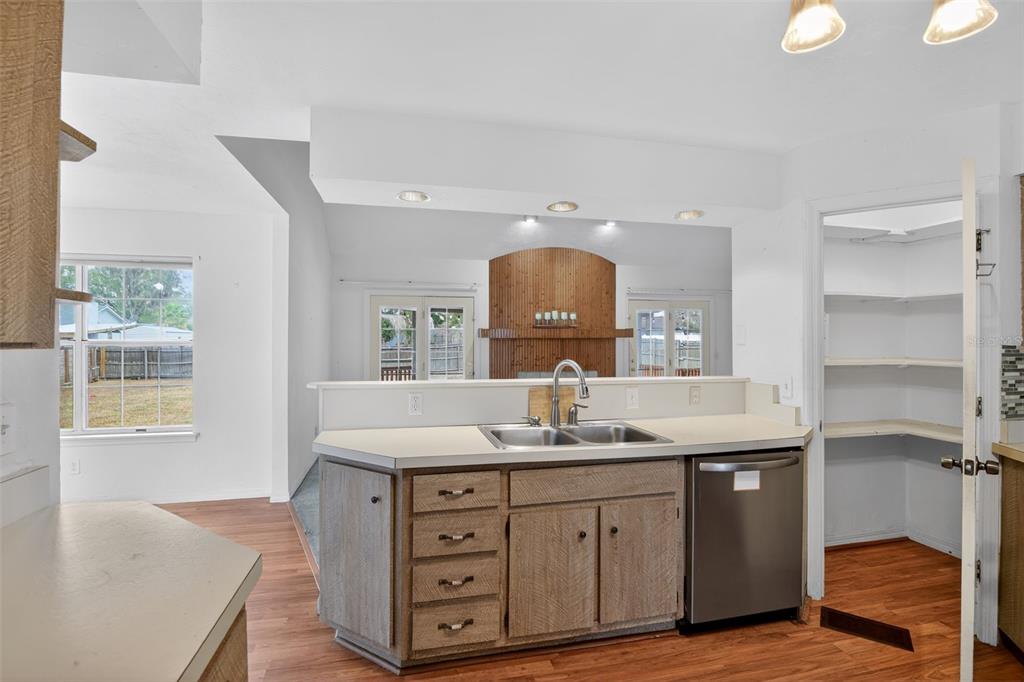 4553 Southeast 14th Street Ocala, FL 34471 - Photo 13 of 28 a bathroom with a granite countertop sink a mirror and a vanity
