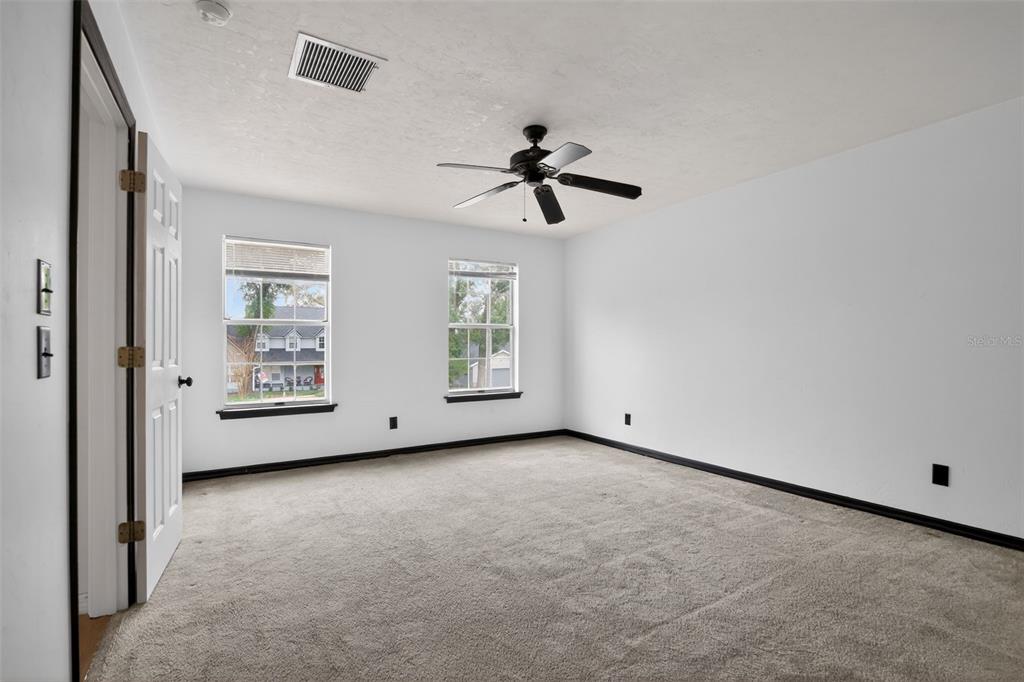 4553 Southeast 14th Street Ocala, FL 34471 - Photo 17 of 28 a view of an empty room with windows