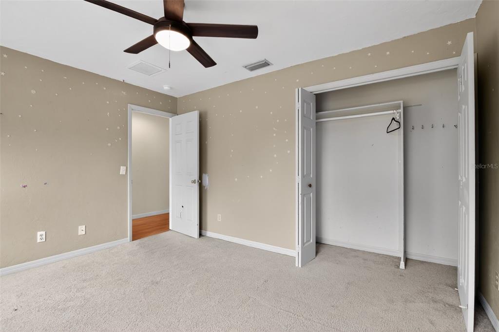 4553 Southeast 14th Street Ocala, FL 34471 - Photo 23 of 28 a view of empty room with ceiling fan