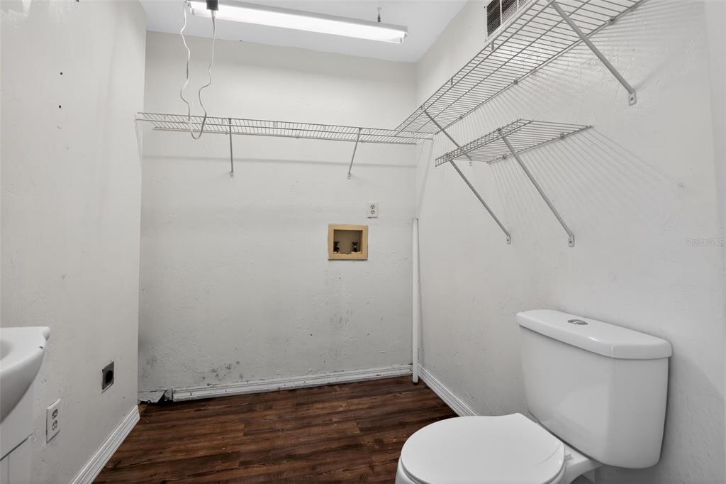 4553 Southeast 14th Street Ocala, FL 34471 - Photo 26 of 28 a white toilet sitting next to a shower