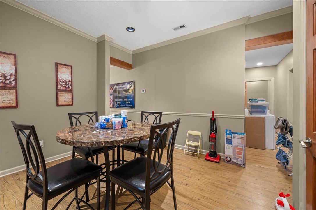 1102 West End Avenue Anderson, SC 29625 - Photo 12 of 28 An inviting dining area offers warm wood flooring and ample space for gatherings.