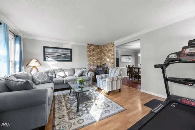 a living room with furniture rug and window