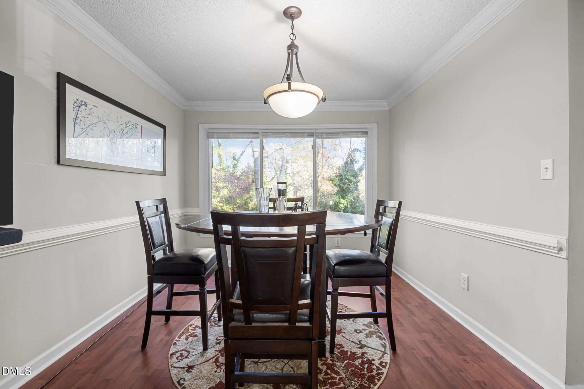 4700 Tolley Court Raleigh, NC 27616 - Photo 15 of 38 a view of a dining room with furniture window and wooden floor