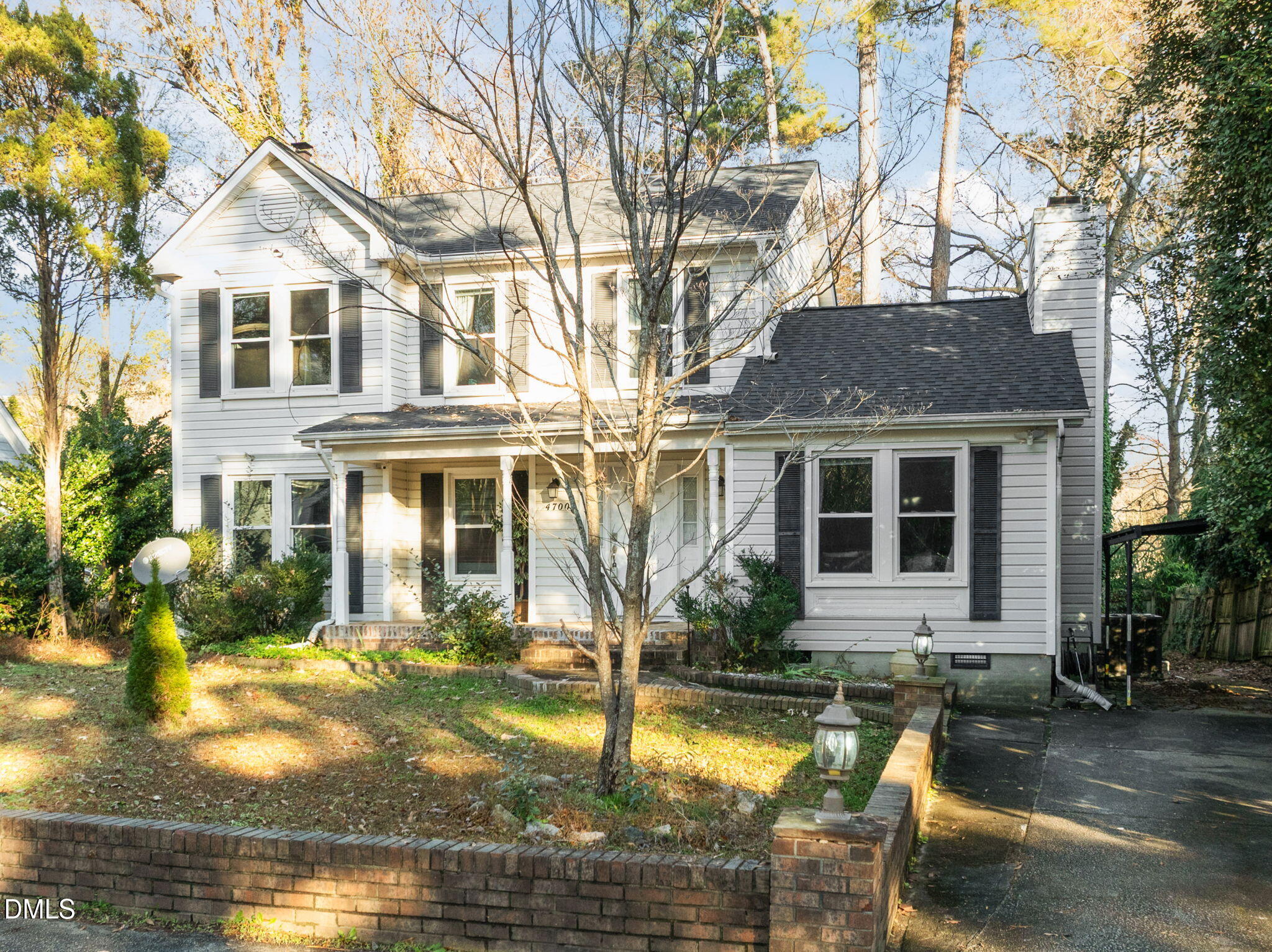 4700 Tolley Court Raleigh, NC 27616 - Photo 2 of 38 a front view of a house with swimming pool and glass windows