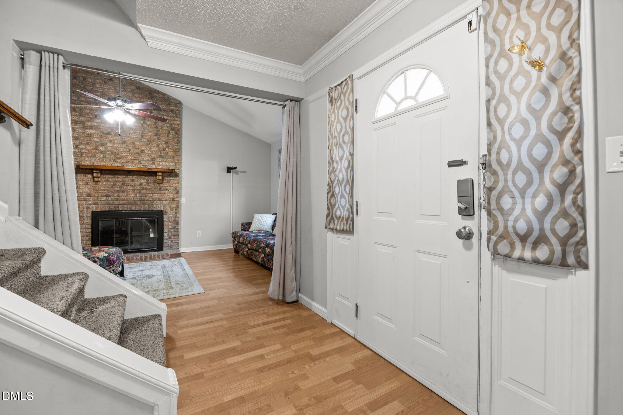 4700 Tolley Court Raleigh, NC 27616 - Photo 5 of 38 a living room with furniture and a fireplace