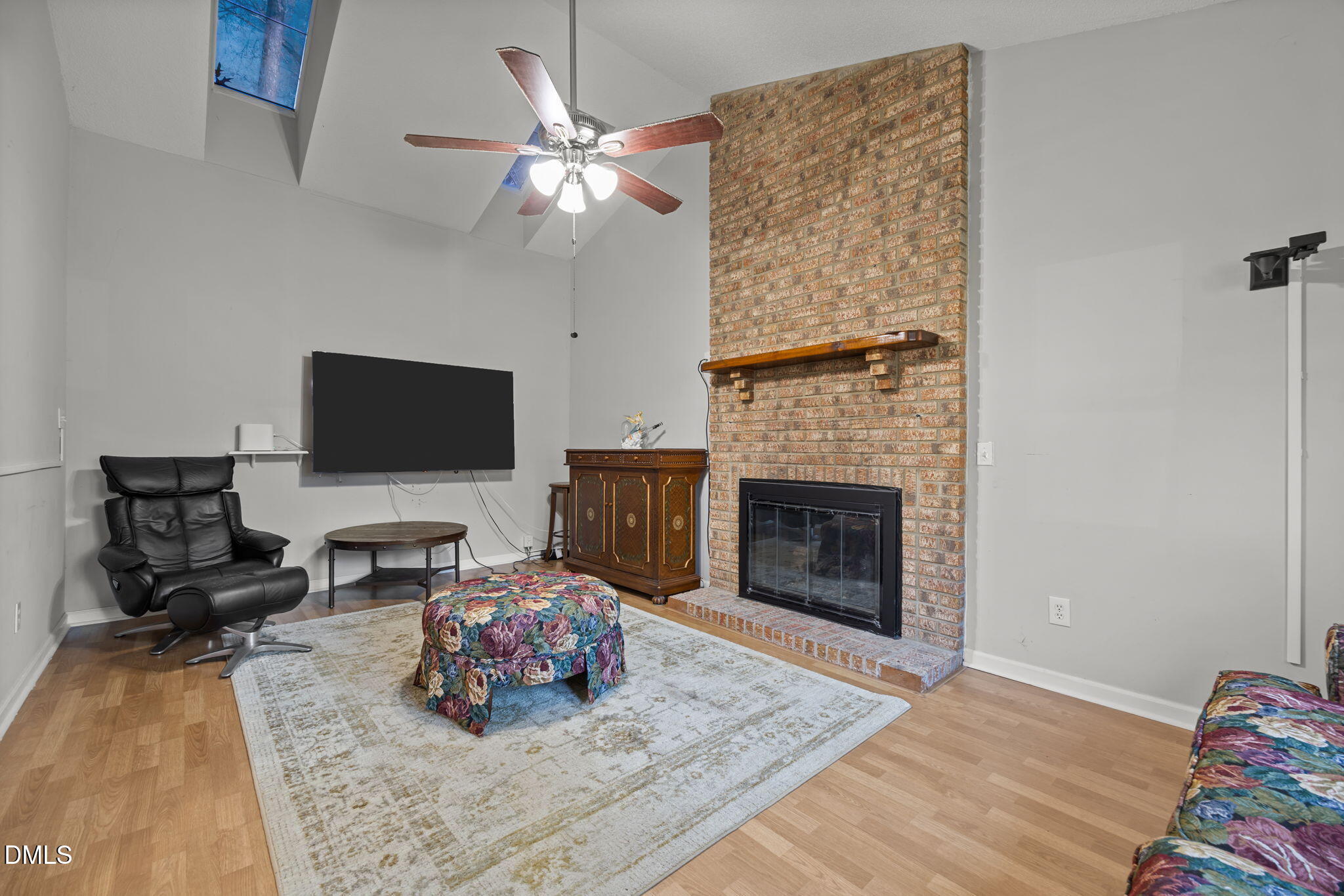 4700 Tolley Court Raleigh, NC 27616 - Photo 6 of 38 a living room with furniture and a fireplace