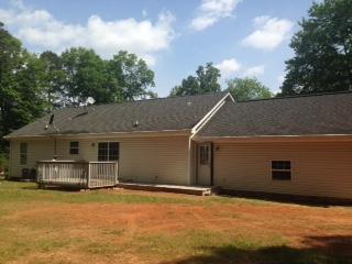 809 Gap Bridge Road Moneta, VA 24121 - Photo 2 of 11 a backyard of a house with table and chairs