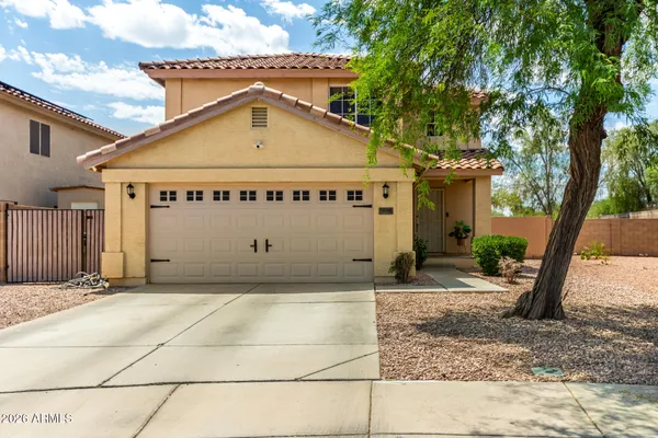 a front view of a house with a garage