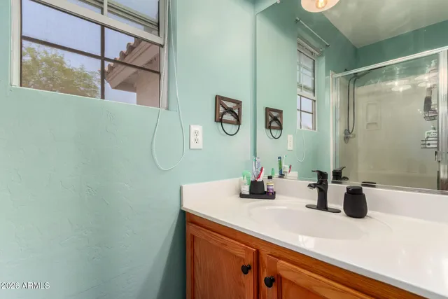 a bathroom with a sink and a mirror