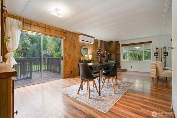 a view of a dining room with furniture window and wooden floor