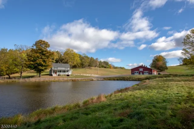 a view of a lake with houses in the back