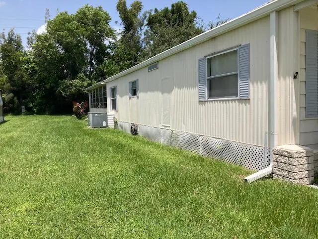 a backyard of a house with lots of green space