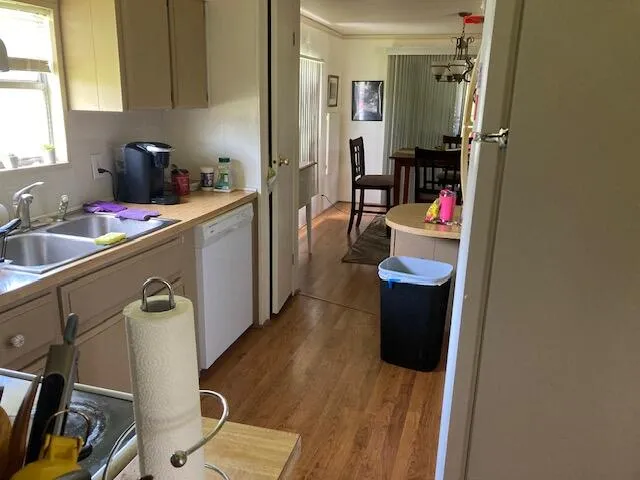 a kitchen with refrigerator and window