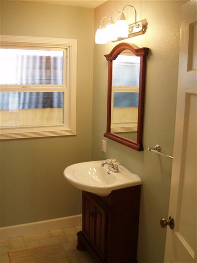 1828 Austin Way Santa Rosa, CA 95404 - Photo 8 of 12 a bathroom with a sink a mirror and a window