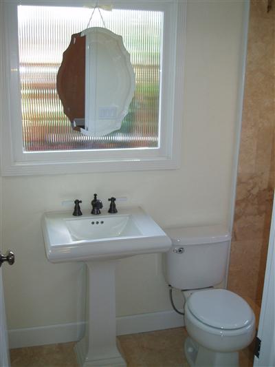 1828 Austin Way Santa Rosa, CA 95404 - Photo 9 of 12 a bathroom with a toilet sink and mirror