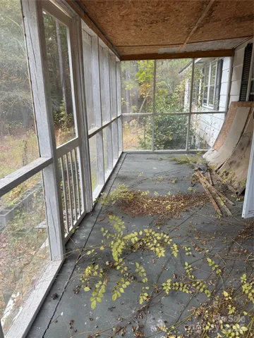 a view of outdoor space with wooden floor