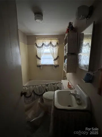 a bathroom with a sink and mirror