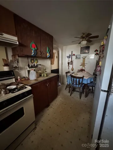 a kitchen with a stove and a microwave