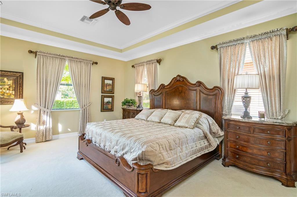 1349 Serrano Circle Naples, FL 34105 - Photo 2 of 37 a bedroom with a bed and a dresser