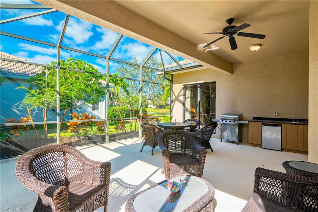 1349 Serrano Circle Naples, FL 34105 - Photo 23 of 37 a outdoor living space with furniture and garden view