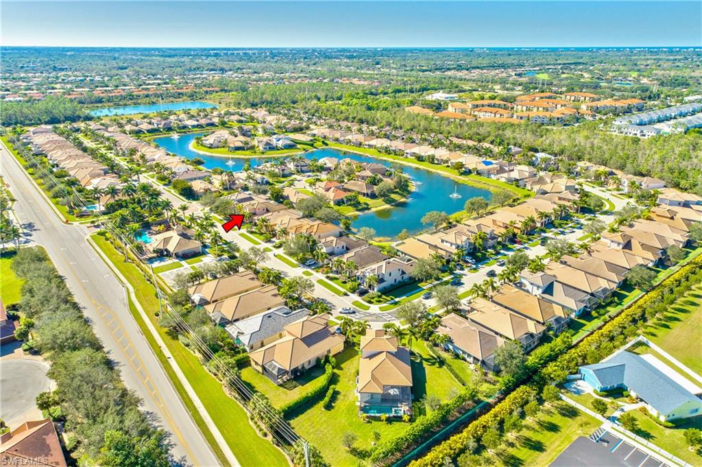 1349 Serrano Circle Naples, FL 34105 - Photo 31 of 37 an aerial view of residential building and lake