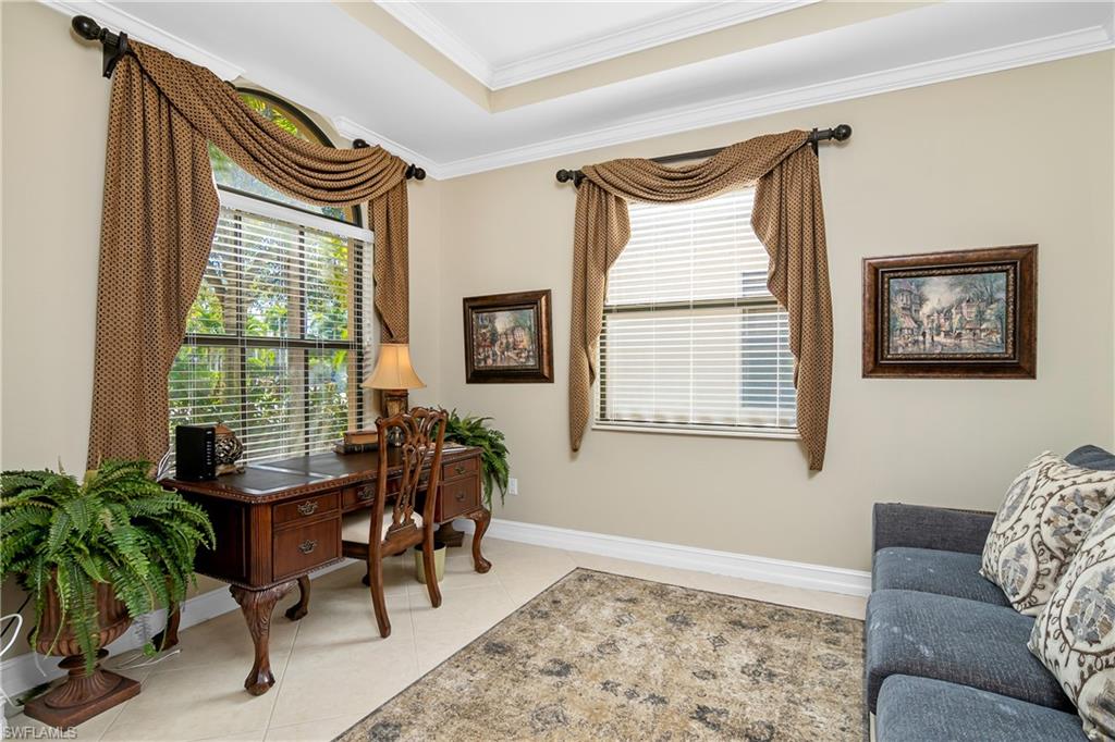 1349 Serrano Circle Naples, FL 34105 - Photo 6 of 37 a living room with furniture and a large window
