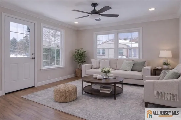 a living room with furniture and a large window