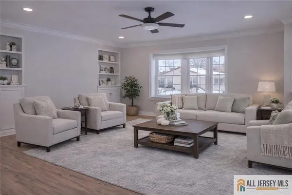 a dining room with stainless steel appliances kitchen island granite countertop a dining table chairs and a kitchen view