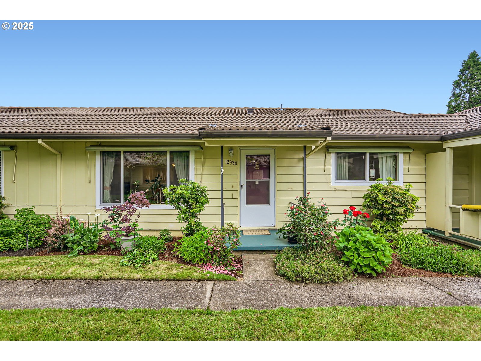 12330 Southeast Main Street Portland, OR 97233 - Photo 1 of 28 a view of a house with a yard