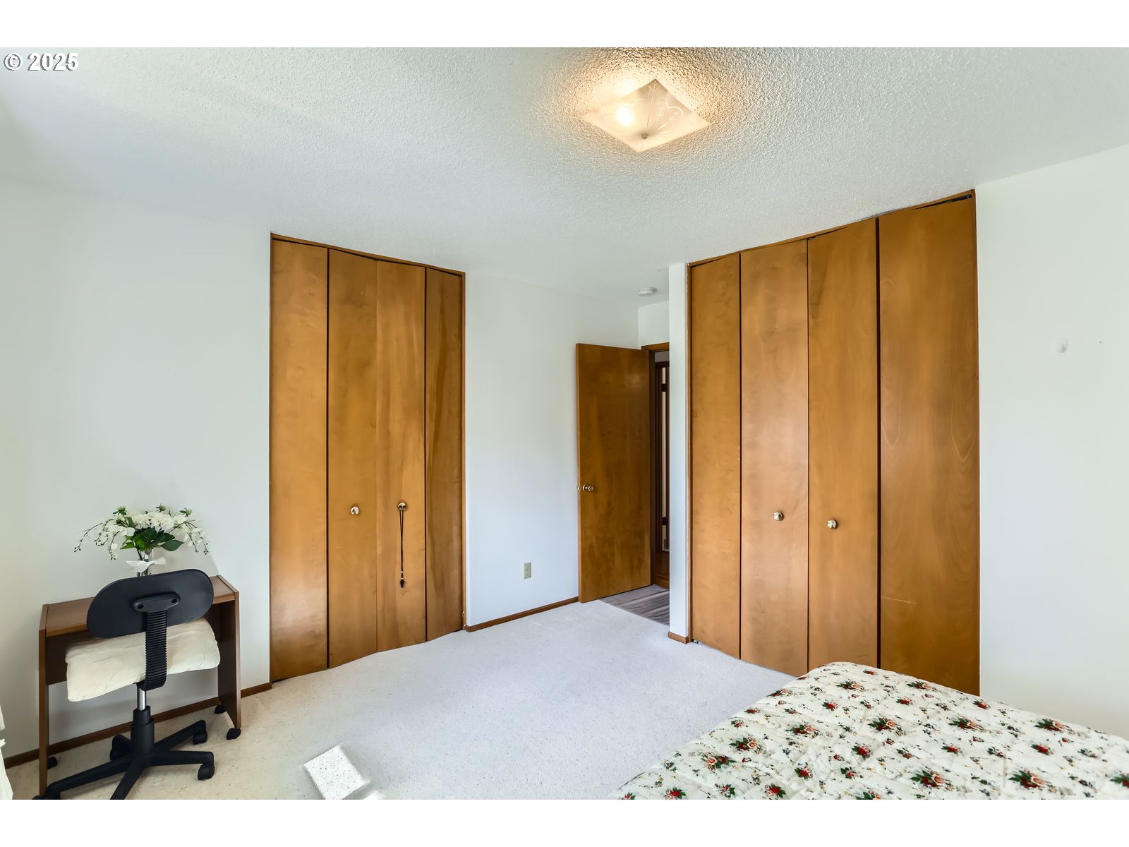 12330 Southeast Main Street Portland, OR 97233 - Photo 17 of 28 a bedroom with a bed and a dresser
