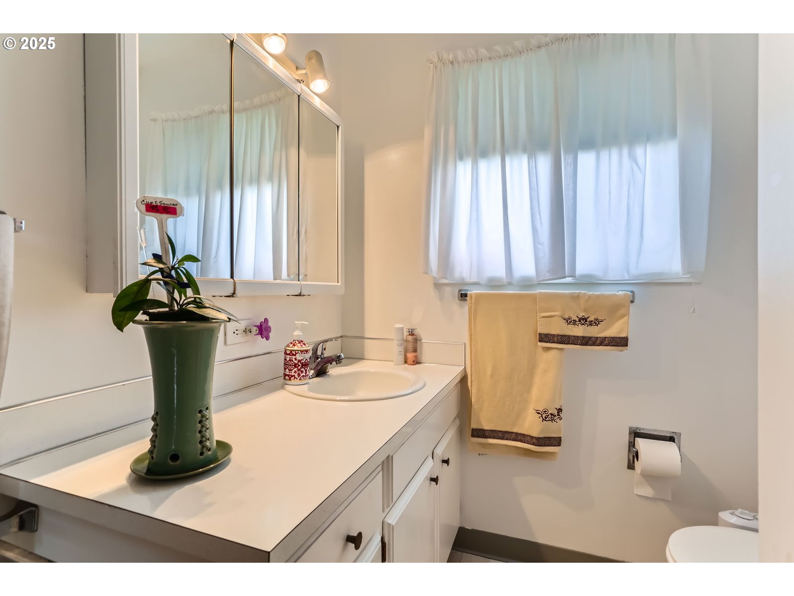 12330 Southeast Main Street Portland, OR 97233 - Photo 19 of 28 a bathroom with a sink and a mirror