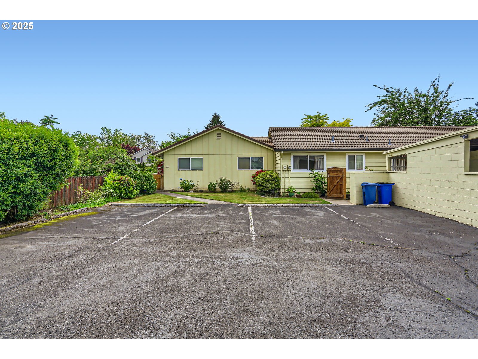 12330 Southeast Main Street Portland, OR 97233 - Photo 27 of 28 a front view of a house with a garden
