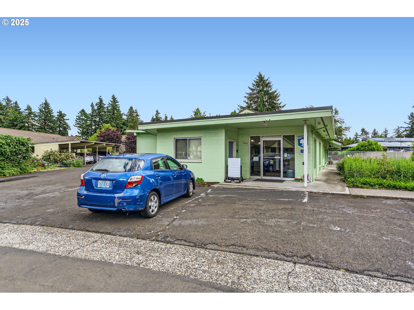 12330 Southeast Main Street Portland, OR 97233 - Photo 28 of 28 a front view of a house with a garden