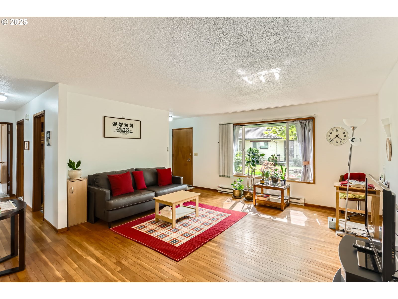 12330 Southeast Main Street Portland, OR 97233 - Photo 5 of 28 a living room with furniture a rug and a window
