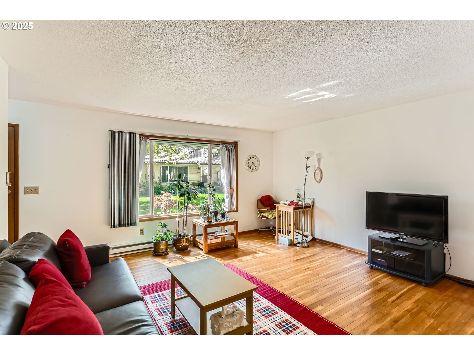 12330 Southeast Main Street Portland, OR 97233 - Photo 6 of 28 a living room with furniture and a flat screen tv