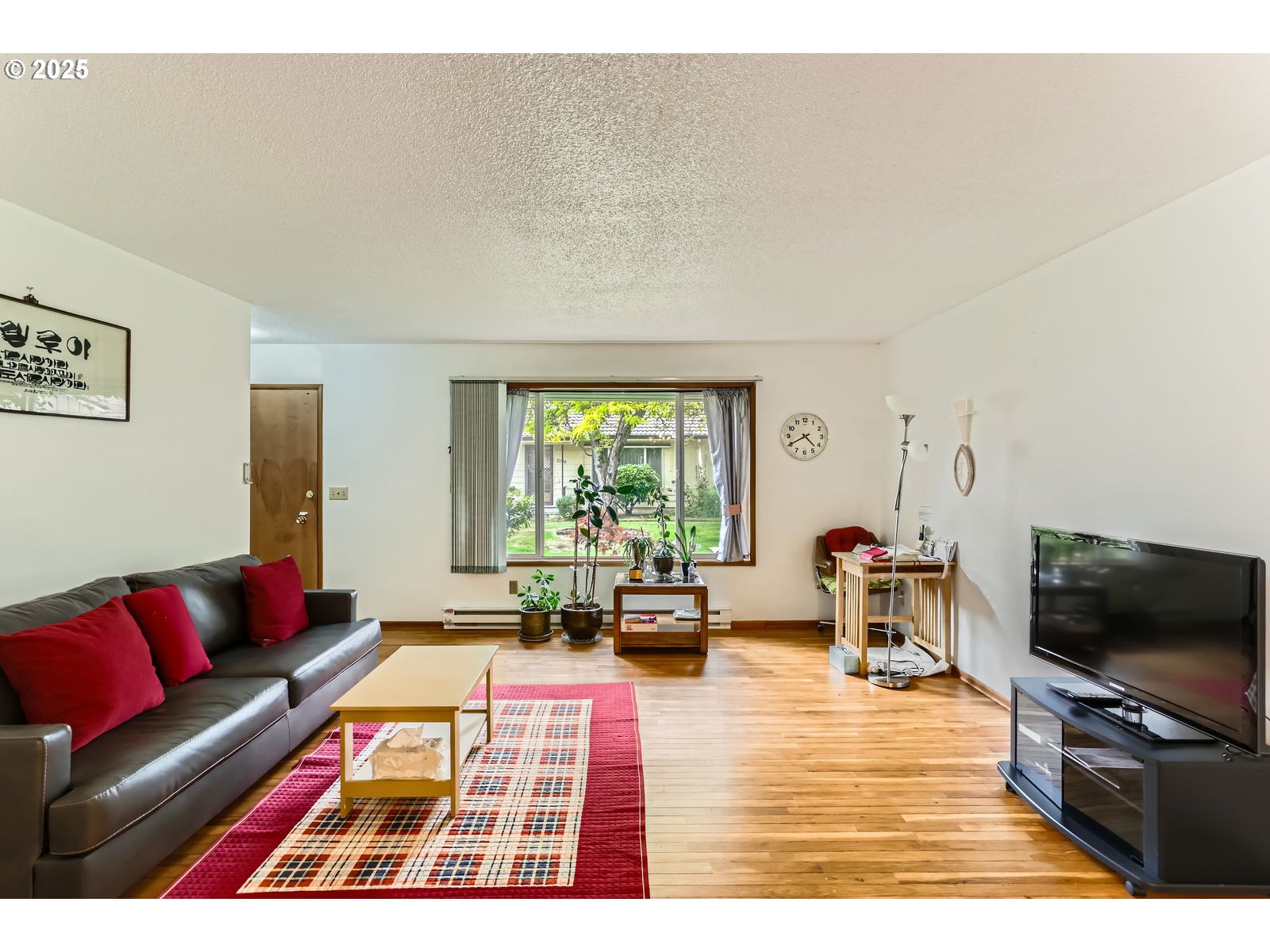 12330 Southeast Main Street Portland, OR 97233 - Photo 8 of 28 a living room with furniture and a flat screen tv