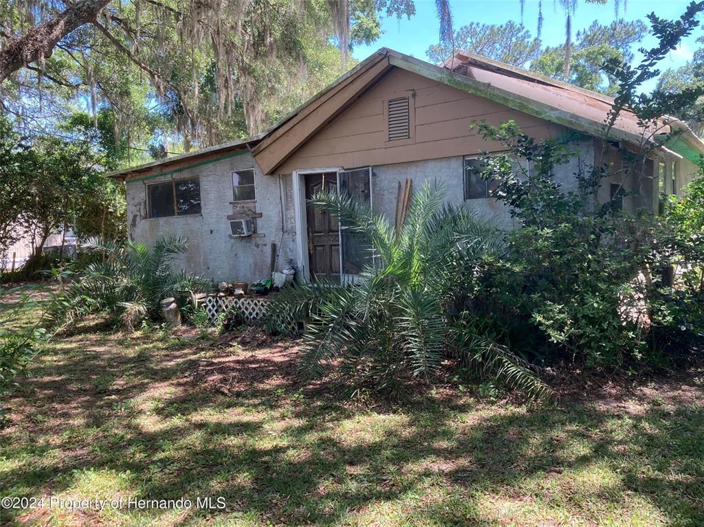 44912 Lacoochee Clay Sink Road Webster, FL 33597 - Photo 1 of 1 a view of a house with a yard