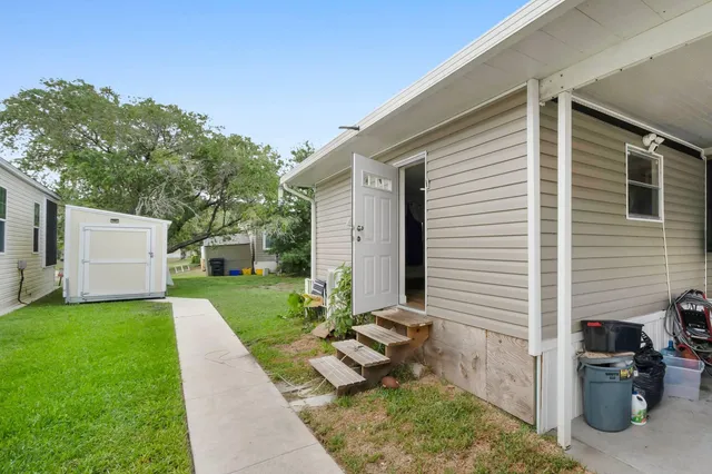a view of a back yard of the house