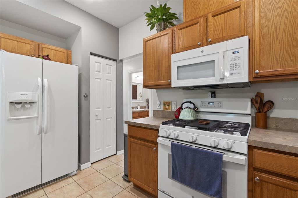 4729 Northeast 16th Terrace Gainesville, FL 32609 - Photo 11 of 41 a kitchen with stainless steel appliances granite countertop a refrigerator stove and sink