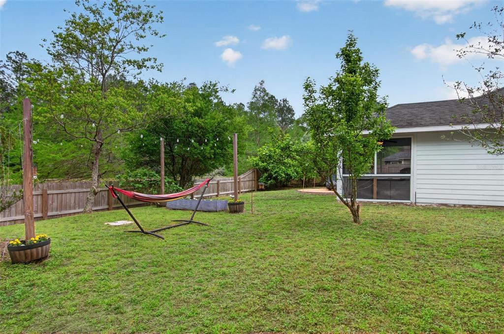 4729 Northeast 16th Terrace Gainesville, FL 32609 - Photo 20 of 41 a view of a house with backyard porch and sitting area