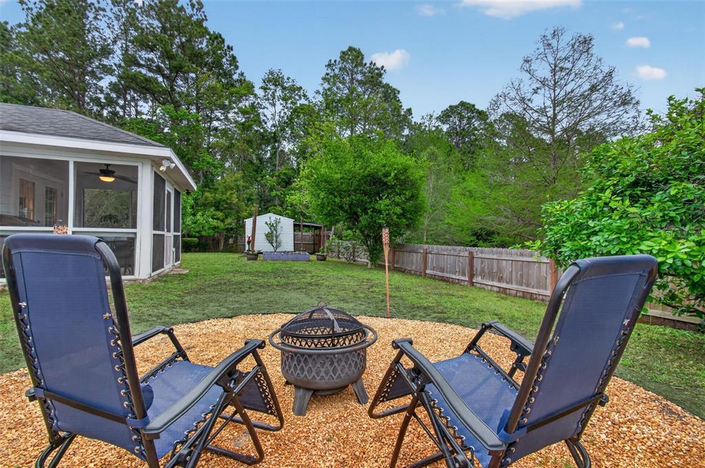 4729 Northeast 16th Terrace Gainesville, FL 32609 - Photo 36 of 41 a view of a backyard with furniture