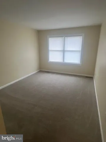 a spacious bathroom with a double vanity sink double and mirror