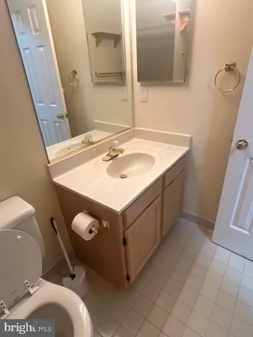 a bathroom with a toilet and a sink