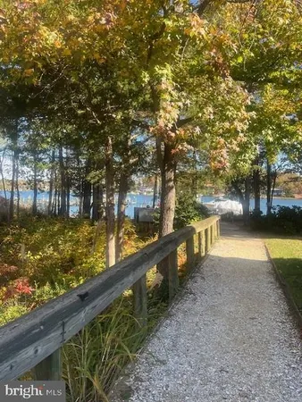 a view of a lake with houses in the background