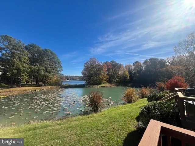 a view of balcony with furniture and wooden floor